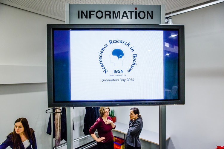A large screen displaying the IGSN logo