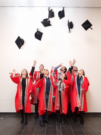 IGSN researchers on Graduation day, throwing their hats into the air