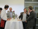 Laurenz Wiskott, Ulf Eysel, Tobias Schmidt-Wilcke and Nikolai Axmacher standing at a table in discussion