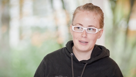 Woman with white glasses