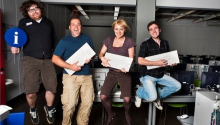 assistants playing air guitar with pc keyboards